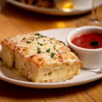Cheesy Garlic Bread · melted provolone on focaccia, served with our homemade marinara on the side