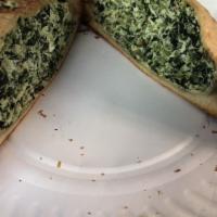 Spinach Calzone · With Onion, Mushrooms, Green Peppers and Cheese.