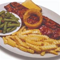 Woody'S Signature Baby Back Ribs · A woody's tradition for nearly four decades. Slow cooked in our secret recipe marinade, then...