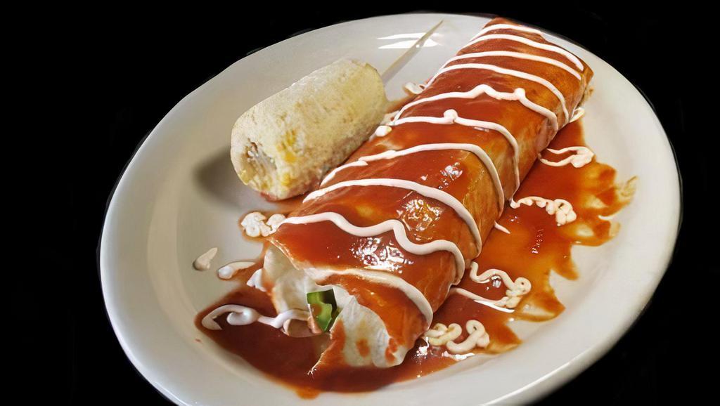 Grande Burrito · Burrito filled with your choice of protein. Filled with rice, beans, pico de gallo, sautéed onions, bell pepper, and cheese. Covered with your choice of green or red sauce drizzled with sour cream.