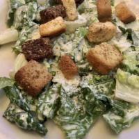 Caesar Salad · Romaine lettuce, croutons and parmesan cheese in our homemade caesar dressing.