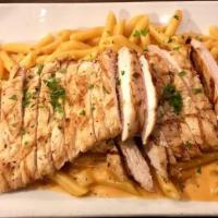 Penne Vodka · Penne pasta tossed in our creamy pink sauce.