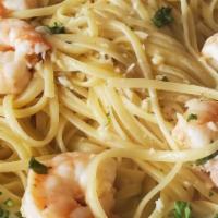 Shrimp Scampi · Sautéed shrimp in a garlic, wine, lemon butter sauce served with pasta.