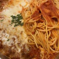Veal Parmigiana · Breaded veal cutlets baked with mozzarella cheese and marinara sauce.