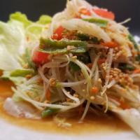 Papaya Salad · Som tom. Shredded green papaya, carrot, tomato, string bean,roasted peanut lime juice, fish ...