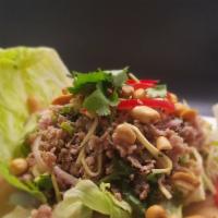 Naem Sod Salad · Lime juice, fish sauce, chili paste bell pepper, onion, scallion, cilantro, slices ginger, a...