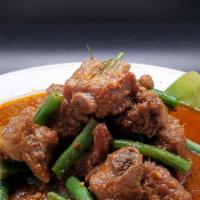 Pad Prick King Short Ribs · Red curry paste with short ribs, string bean, citrus leaves