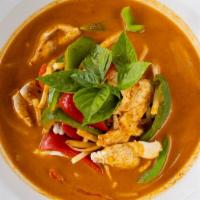 Red Curry · Coconut milk, red chili paste, bell peppers, bamboo shoots and basil leaves.