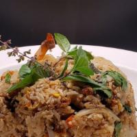 Basil Fried Rice · Stir fried rice, eggs, onions, carrots, scallion, basil leaves, and chili sauce