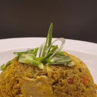 Yellow Curry Fried Rice · Curry fried rice with egg yellow curry, onions, baby corn,carrots, scallions.