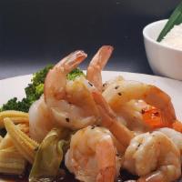 Shrimp Teriyaki · Broiled shrimp smothered in teriyaki sauce  on top  of steamed mixed vegetable ans a side of...