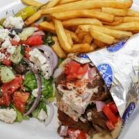 Traditional Gyro Wrap Platter · Lamb and beef meat, served on a warm fluffy pita, with sliced tomatoes, onions, and tzatziki...