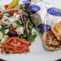 Authentic Gyro Melt Platter · Open face pita with pork gyro meat, grilled onions, tomatoes, feta cheese, and melted white ...