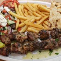 Pork Souvlaki · With tzatziki. Include two skewers. Served with Greek salad and toasted pita.