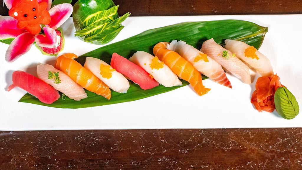 Sushi Deluxe · 13 pieces of assorted sushi with tobiko,ikura ,spicy fresh tuna sushi and tuna roll