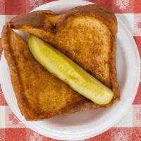 Grilled Cheese Sandwich · Honey wheat bread grilled with melted American cheese and served with a pickle.