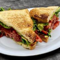 Salami L & T · Thinly Sliced Salami slightly Grilled, on White Toast with our New Signature Roasters Mayo, ...