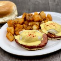 Eggs Benedict · English Muffin topped with Grilled Ham, Poached Eggs, and Homemade Hollandaise Sauce.