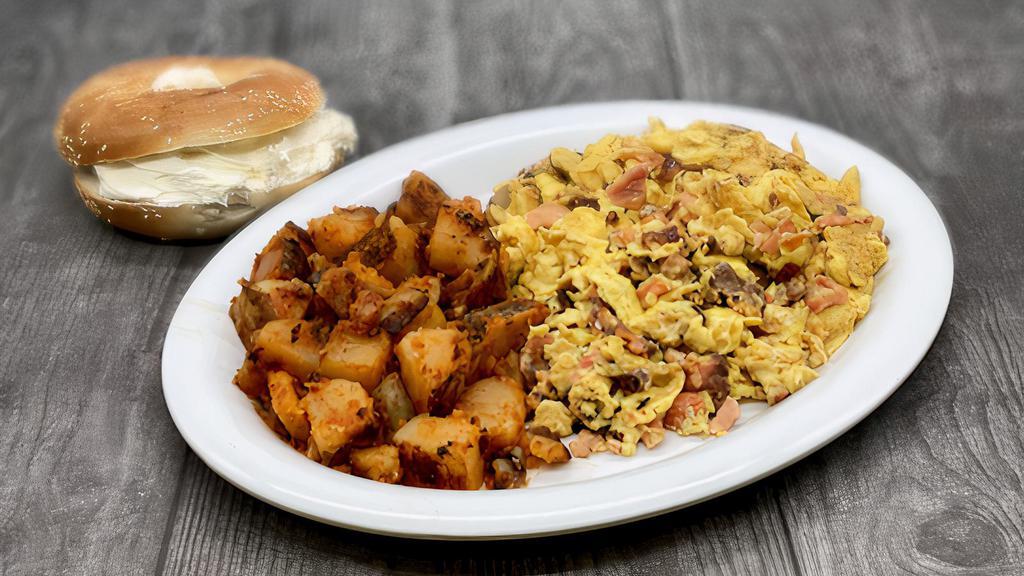 Nova & Onion Scramble · Chopped Nova and Onions Sautéed together and mixed in with Scrambled Fluffy Eggs.