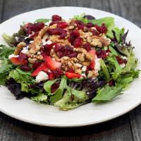Cranberry Salad · Baby Greens, Walnuts, Strawberries, Cranberries, topped with Crumbled Feta Cheese. Served wi...