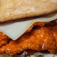 Briscoe Inferno Sandwich · Fried chicken breast tenderloins tossed in Buffalo Jack's Wang sauce, topped with swiss chee...