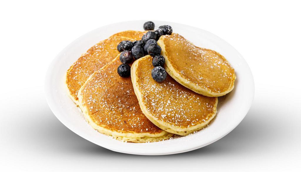 Blueberry Pancakes · 6 buttermilk pancakes filled with blueberries. topped with fresh blueberries and powdered. sugar. Served with blueberry syrup