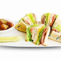 Club Sandwich · Fresh turkey, ham, American and Swiss cheese piled high on your choice of toast with lettuce...