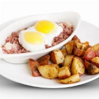 Homemade Corned Beef Hash · Topped with 2 eggs any style.. Served with your choice of potatoes.