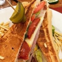 Sandwich Cubano · Classic Cuban Sandwich made with Ham, Pork, Swiss cheese, pickles and a touch of mustard on ...