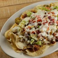 Nachos · Chips, lettuce, chili, mixed cheese, pico de gallo, queso and jalapenos.
