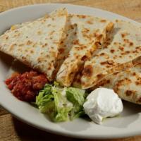 Quesadilla · Beef or chicken, grilled onions, mixed cheese, chipotle ranch drizzle, flour tortilla, salsa...