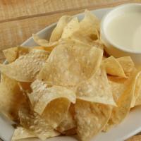 Chips & Queso · Chips and melted cheese.
