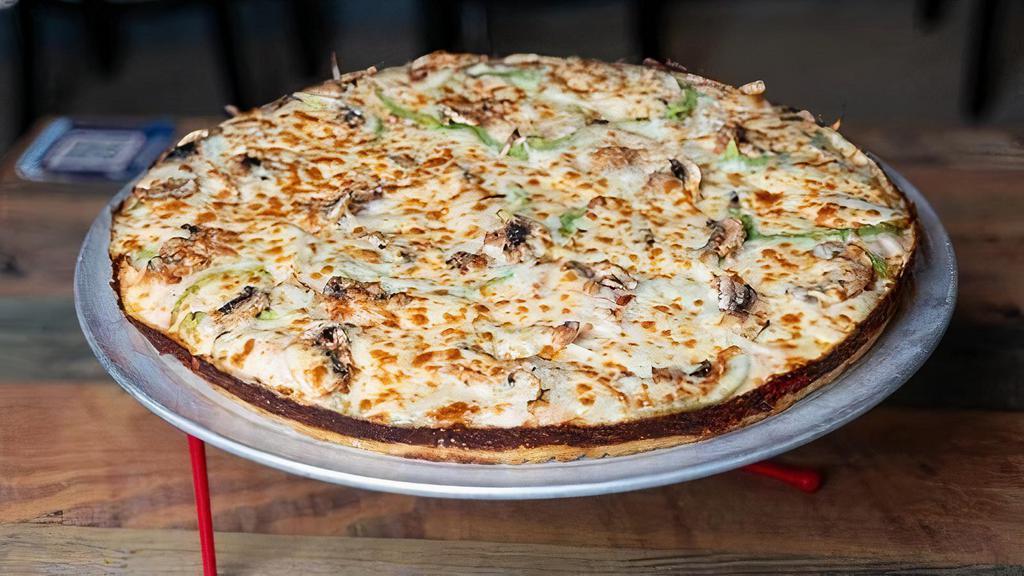 Familiar De Vegetales · A vegetable pizza with onions, green peppers, mushrooms and tomatoes.
