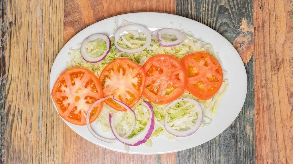 Ensalada De La Casa · House Salad (lettuce, tomato, onion, ranch dressing)