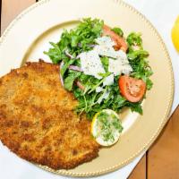 Chicken Milanese · Lightly Pan-fried chicken breast. Served with arugula and shaved parmesan salad to top.