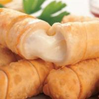 Tequeños · 3 Finger size cheese sticks, filled with white cheesez wrapped in a delicious dough.