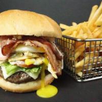 Latín Burger · Your choice of meat pbs styled, fried egg, potato sticks, lettuce, tomato, ham, white americ...
