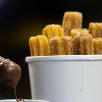 Churros · Made from deep-fried dough and sprinkled with sugar. Served with nutella or dulce de leche.