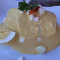 Papa À La Huancaina · Potatoes dressed in a creamy yellow pepper sauce. Substitute with yuca (Cassaba).