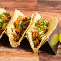 Taco Trio (Medium Size Tortilla, Natural Corn) · Choose 3 of your favorite Tacos. 
With onion, Cilantro and Sauces