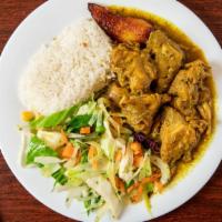 Curry Chicken · Served with rice and peas or white rice and vegetables.