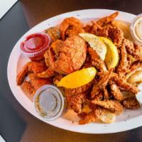 Touchdown · Fried shrimp, oysters, lobster tails, tilapia, fries, and dipping sauce.