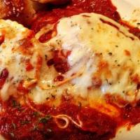 Cheese Ravioli · Stuffed with Ricotta Cheese topped with tomato sauce, mozzarella then baked. Served with gar...
