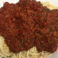 Spaghetti With Meat Sauce · Fresh cooked Spaghetti topped with our house made Meat Sauce served with garlic rolls