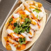 Lemon Pepper Wet · Marinated chicken thigh tossed in buffalo sauce and topped with red onions and cilantro. Ser...