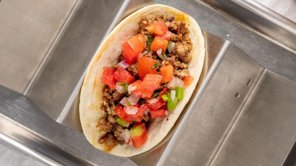 Impossible Taco · Ground impossible meat with pico de gallo, red onions, and cilantro..