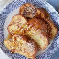 Challah French Toast · Thick sliced challah bread dipped in egg wash and pan fried. Accompanied with pecan wood smo...