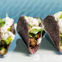 Tacos · Three tacos stuffed with Impossible beef, pico, sour cream