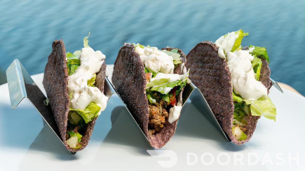 Tacos · Three tacos stuffed with Impossible beef, pico, sour cream