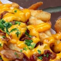 Fries And Shine · Idaho Potato Fries cooked until golden brown with Bacon decorated with a touch of Green Onions